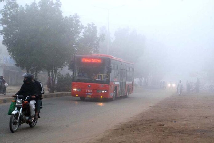 A view of thick smog, causing disruption to routine traffic and making people vulnerable to respiratory diseases.