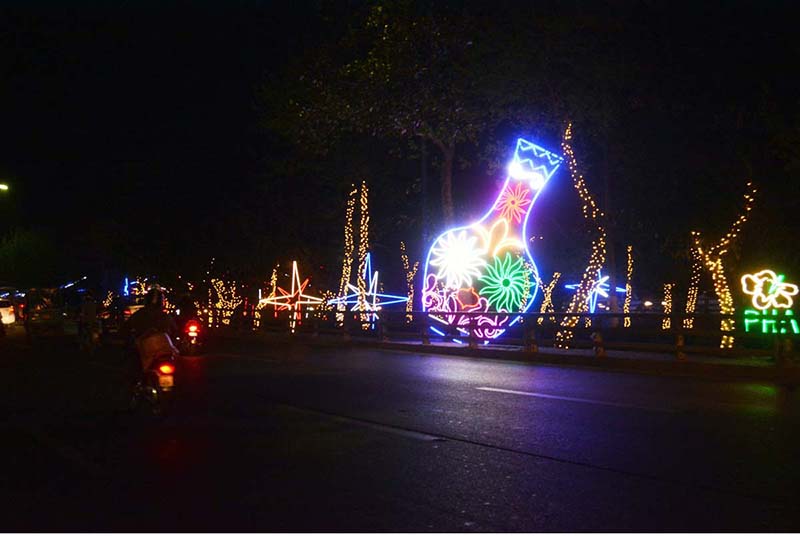 A beautifully decorated view of Canal Road at night. 