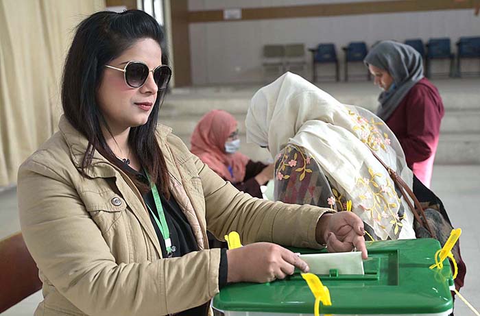 Women standing in queue waiting for their turn to cast their vote at polling station during General Election-2024.