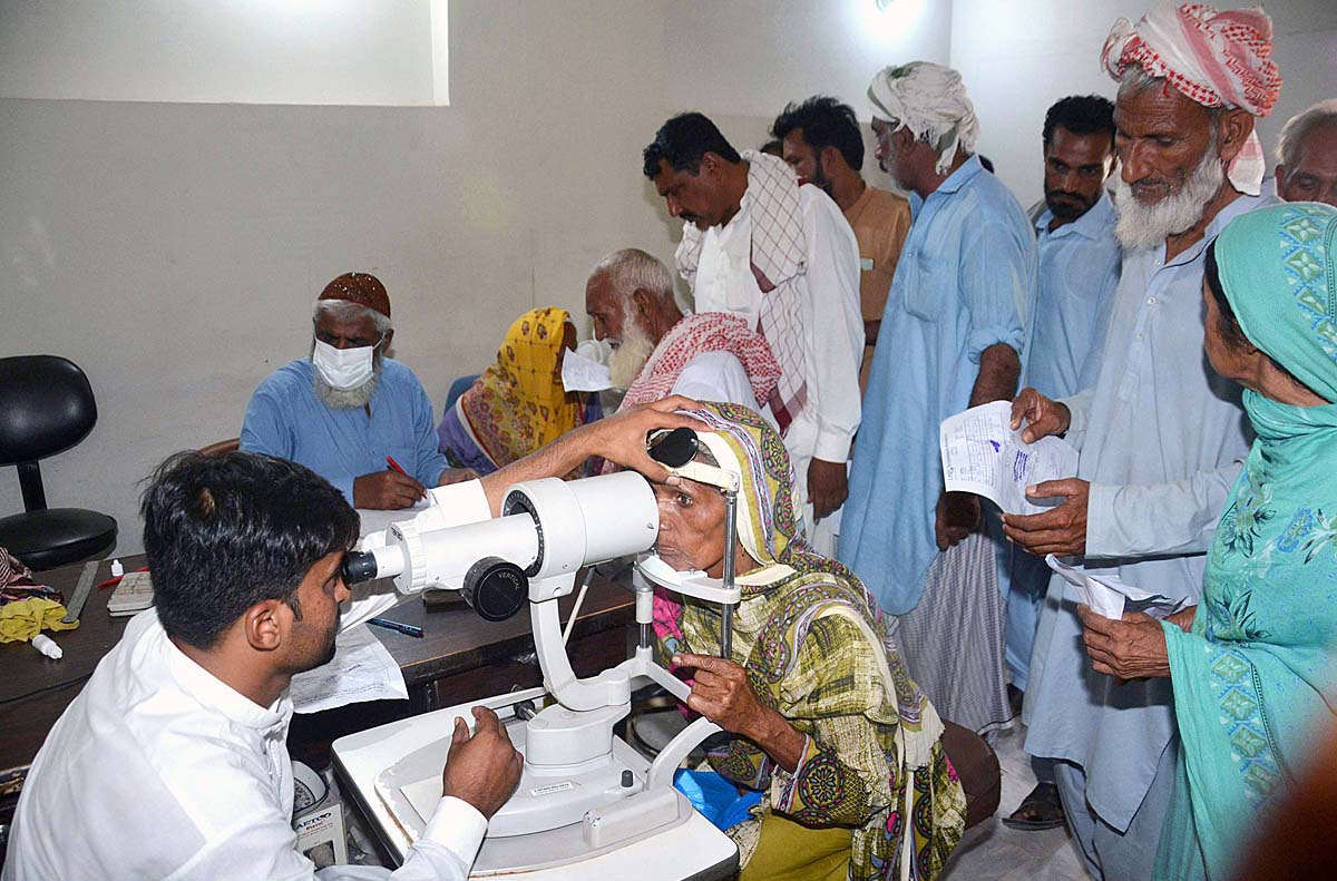 A doctor examines a patient’s eyes after rising eye infections at LRBT Secondary Eye Hospital.