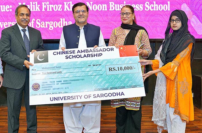 Vice Chancellor University of Sargodha Dr. Qaiser Abbas distributing Chinese Ambassador Scholarship cheques among the students at University of Sargodha